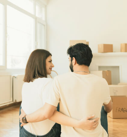 A young couple moving into a new home